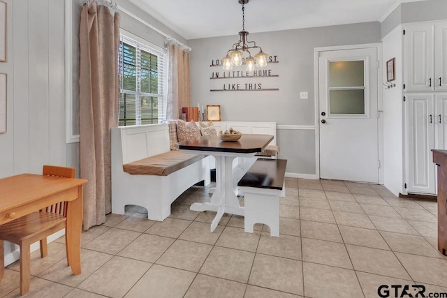 dining space featuring breakfast area, light tile patterned floors, and a chandelier