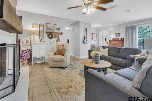 living room with light tile patterned floors and ceiling fan