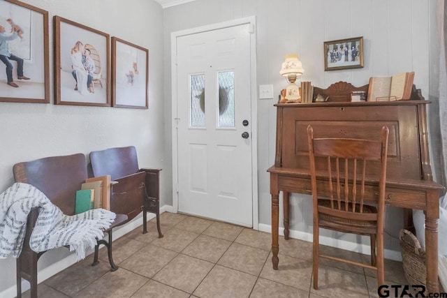 entryway featuring wooden walls and light tile patterned floors