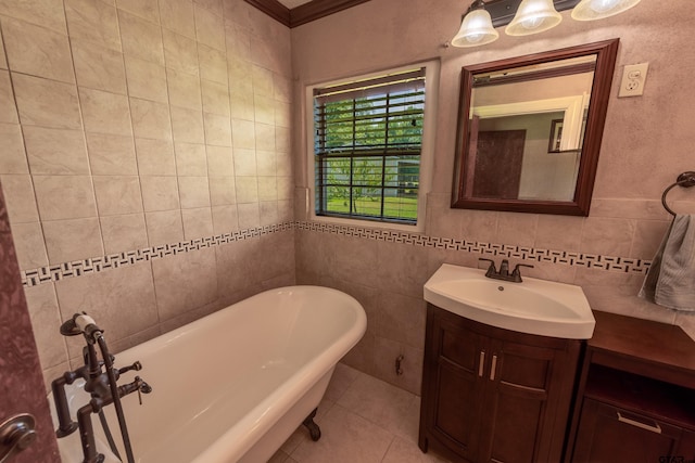 bathroom with vanity, tile patterned flooring, a bathing tub, and tile walls