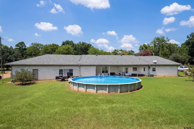 back of house featuring a yard