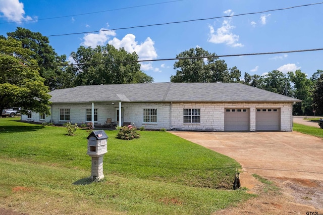 single story home with a garage and a front lawn