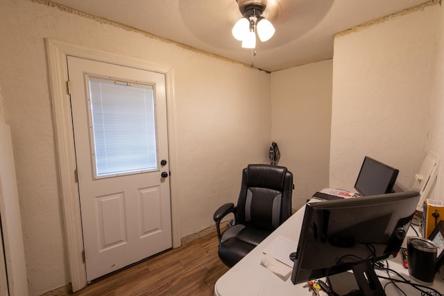 office with ceiling fan and dark hardwood / wood-style flooring