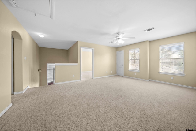 empty room featuring light carpet and ceiling fan