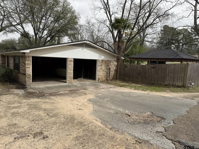 garage featuring fence