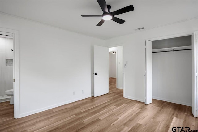 unfurnished bedroom with ceiling fan, baseboards, light wood-type flooring, visible vents, and a closet