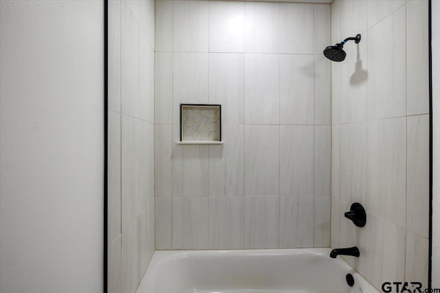 bathroom with washtub / shower combination