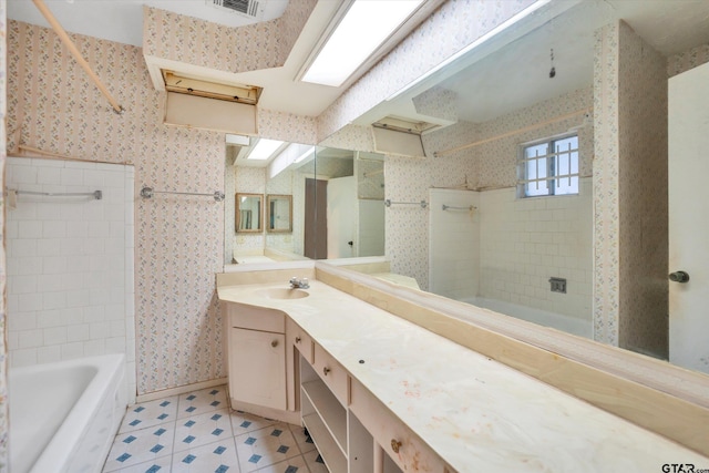 12411 Drifting Winds Dr, Houston, TX 77044 - bathroom with wallpapered walls, double vanity, tile patterned floors, and shower / bathtub combination