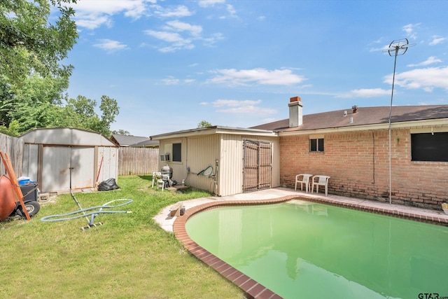 12411 Drifting Winds Dr, Houston, TX 77044 - back of property featuring a chimney and brick siding