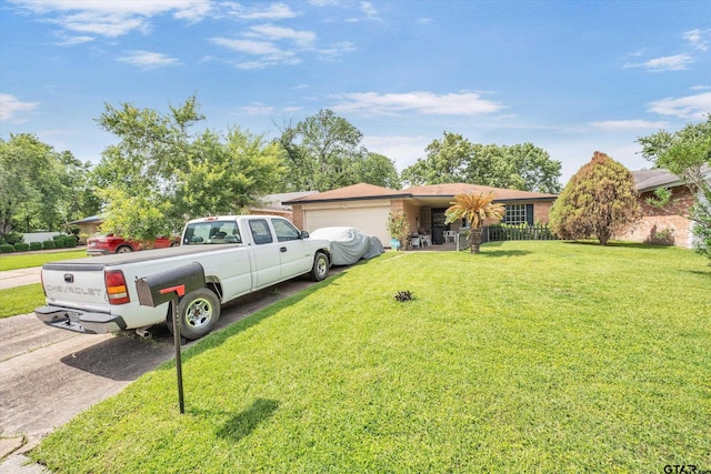 12411 Drifting Winds Dr, Houston, TX 77044 - single story home with an attached garage, a front yard, concrete driveway, and brick siding
