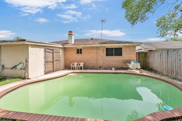 12411 Drifting Winds Dr, Houston, TX 77044 - view of pool featuring a patio