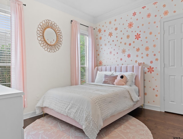 bedroom with ornamental molding and dark wood-type flooring