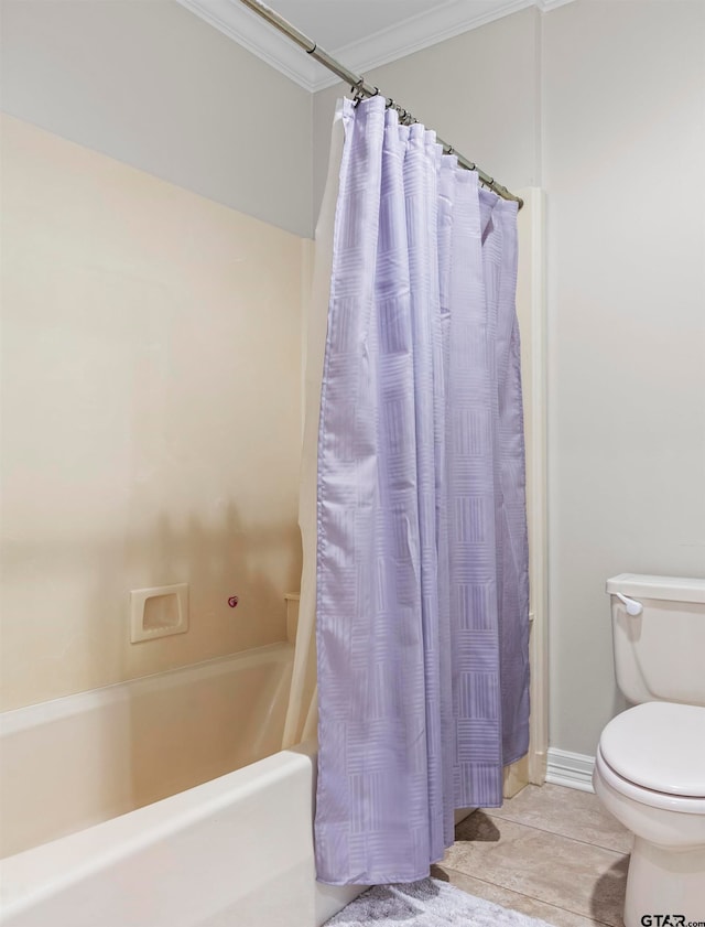 bathroom with ornamental molding, toilet, shower / bath combo, and tile patterned floors