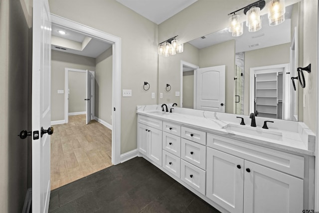 bathroom with vanity and hardwood / wood-style flooring