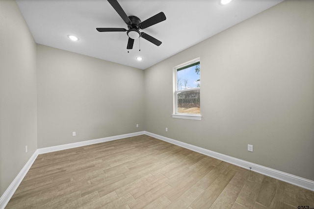 spare room featuring ceiling fan and light hardwood / wood-style floors