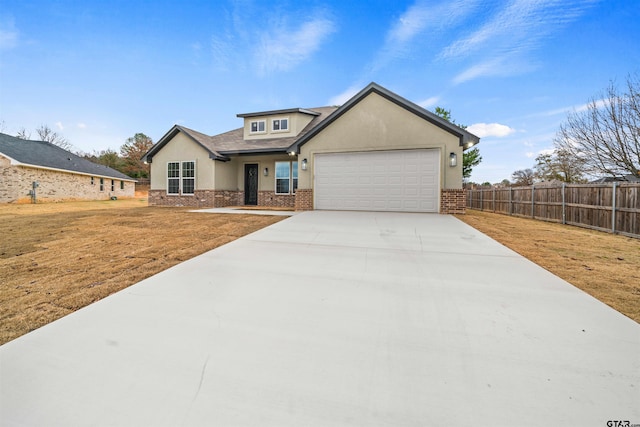 view of front facade with a garage and a front lawn