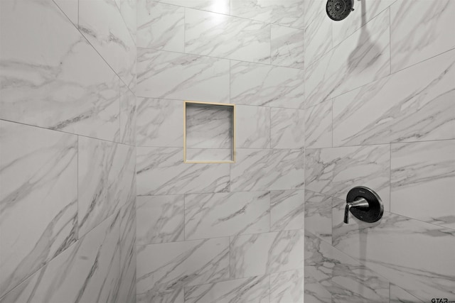 details with a tile shower