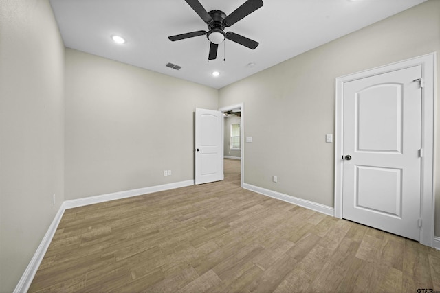 unfurnished bedroom featuring light hardwood / wood-style floors and ceiling fan