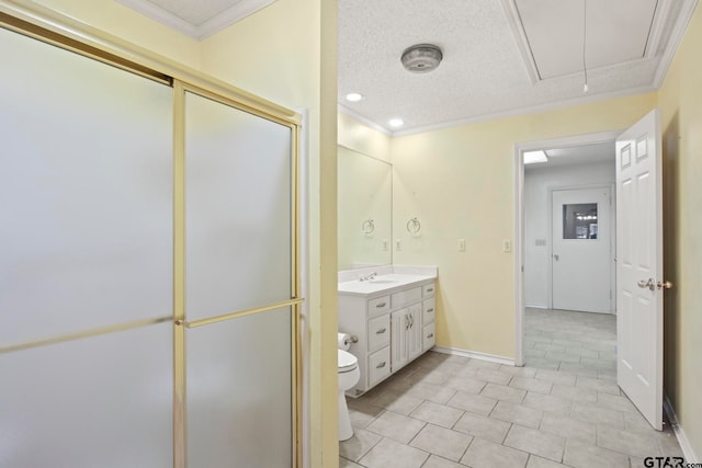 bathroom with vanity, toilet, an enclosed shower, and ornamental molding