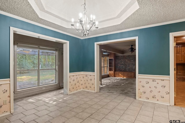 tiled empty room with ceiling fan with notable chandelier, a textured ceiling, and crown molding