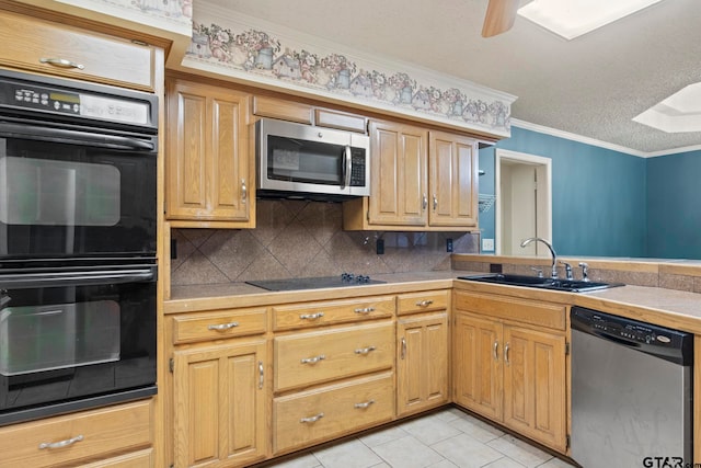 kitchen featuring black appliances, a textured ceiling, sink, crown molding, and a skylight