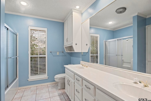 full bathroom with tile patterned flooring, a textured ceiling, toilet, and ornamental molding