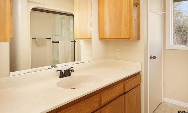 bathroom featuring tile patterned flooring and vanity