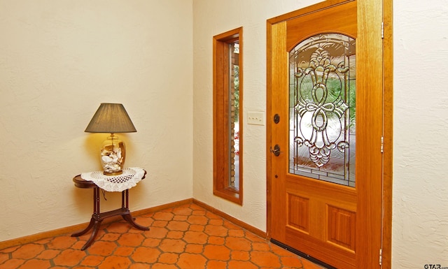 foyer featuring tile patterned flooring