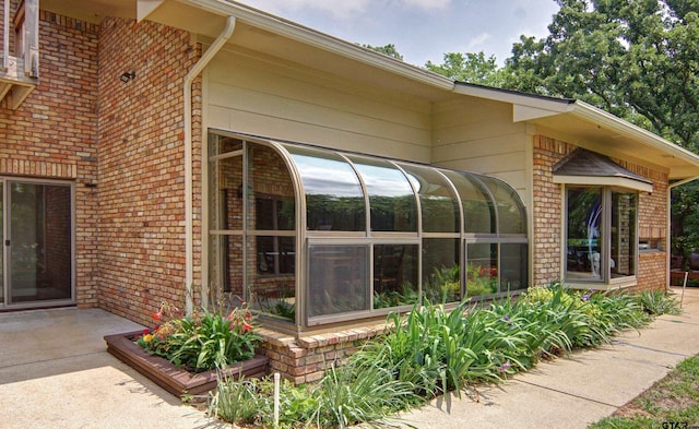 exterior space featuring a sunroom