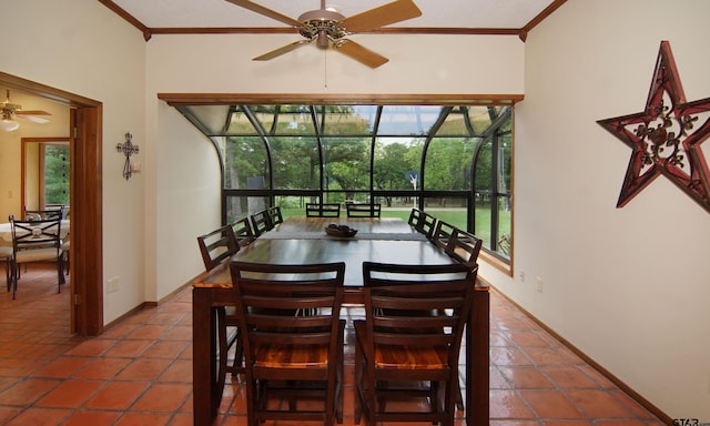 tiled dining area with plenty of natural light, ceiling fan, and crown molding