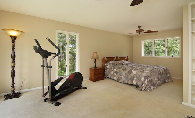 bedroom with ceiling fan and light colored carpet