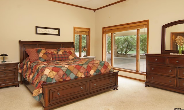 carpeted bedroom with access to exterior and ornamental molding