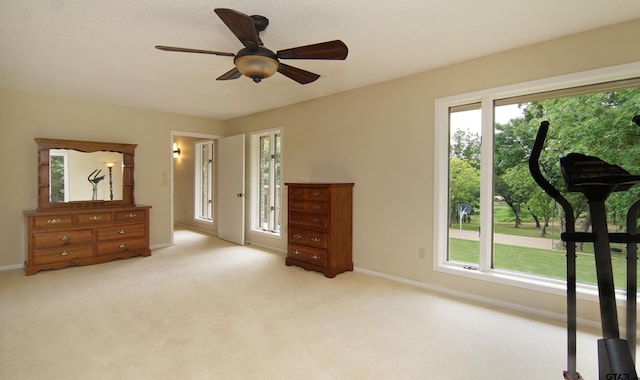 bedroom featuring light colored carpet and ceiling fan