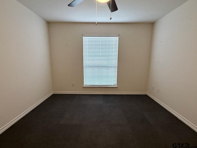 1521 Rice Rd Unit Z103, Tyler, TX 75703 - unfurnished room featuring a ceiling fan, dark carpet, and baseboards