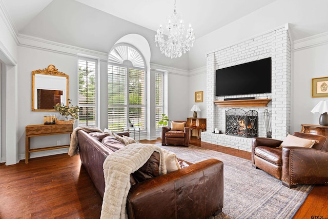 6307 Shady Oaks Dr, Tyler, TX 75703 - living room featuring wood finished floors, a chandelier, a fireplace, and lofted ceiling