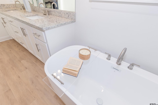307 Amanda Ave, Bullard, TX 75757 - full bath with wood finished floors, a soaking tub, and double vanity