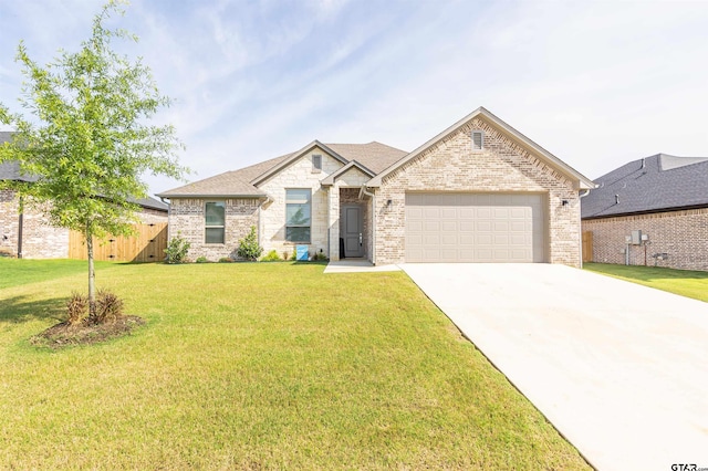 view of front facade with a garage and a front yard