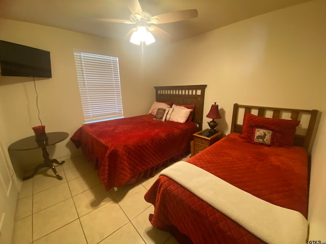 bedroom with light tile patterned floors and ceiling fan