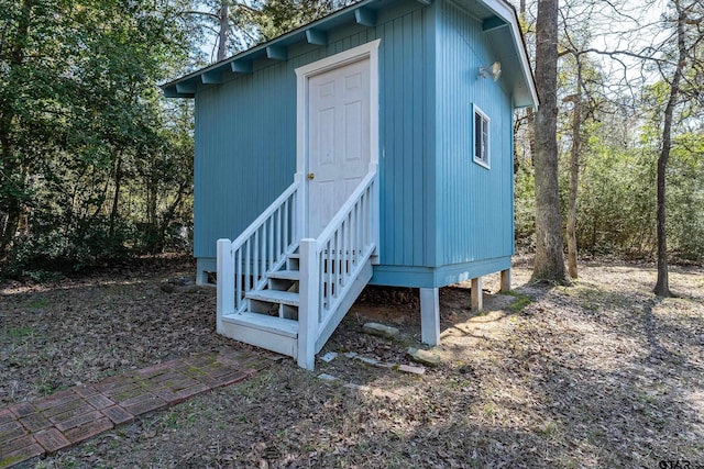 view of outbuilding featuring entry steps and an outbuilding