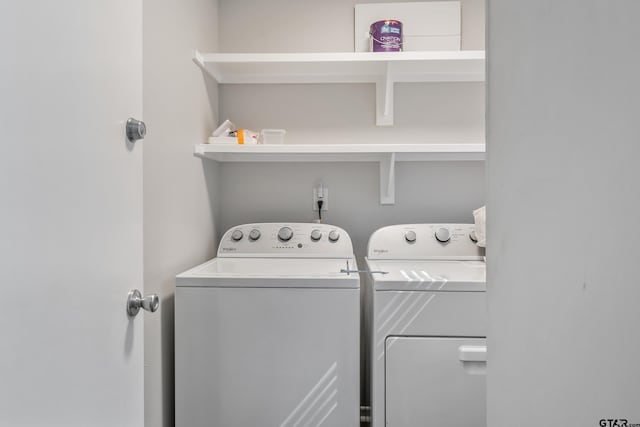 washroom featuring laundry area and washing machine and clothes dryer