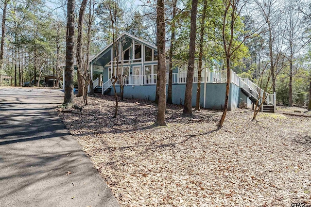 exterior space featuring a porch and stairway