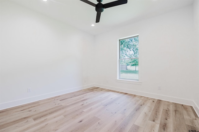 spare room featuring baseboards, ceiling fan, recessed lighting, and wood finished floors