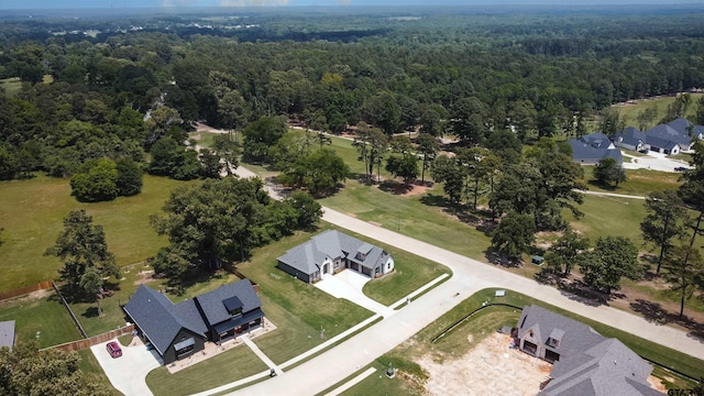 aerial view with a forest view and a residential view