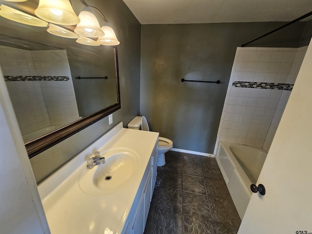 205 E Emma St, Bullard, TX 75757 - full bathroom with bathtub / shower combination, stone finish flooring, toilet, vanity, and baseboards