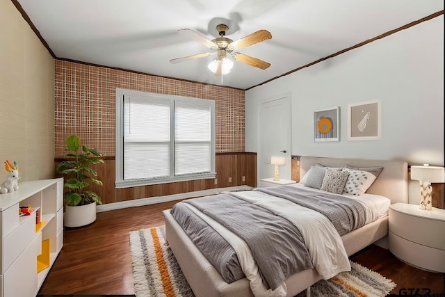 bedroom with ceiling fan, dark hardwood / wood-style flooring, and crown molding