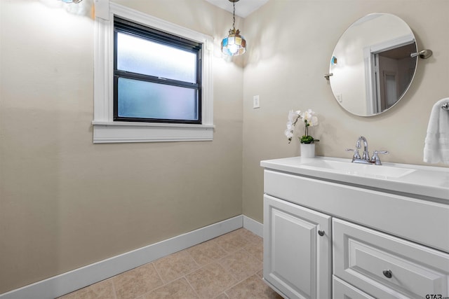 bathroom with tile patterned flooring and vanity