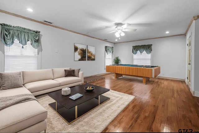 living room featuring hardwood / wood-style flooring, crown molding, ceiling fan, and billiards