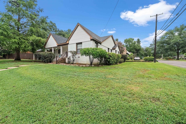 view of side of home featuring a yard