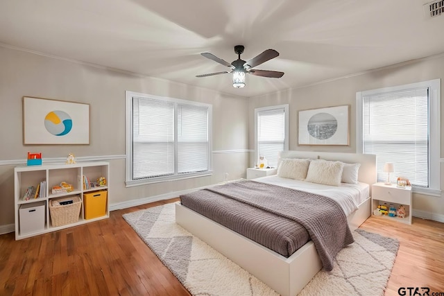 bedroom featuring wood-type flooring and ceiling fan