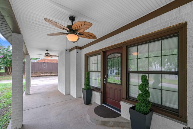 entrance to property featuring ceiling fan